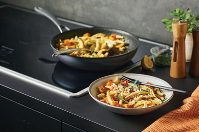 Pasta being cooked in a Circulon ScratchDefense A1 Series frying pan on an induction cooktop