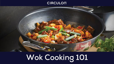 Vegetables and chicken stir frying in a wok