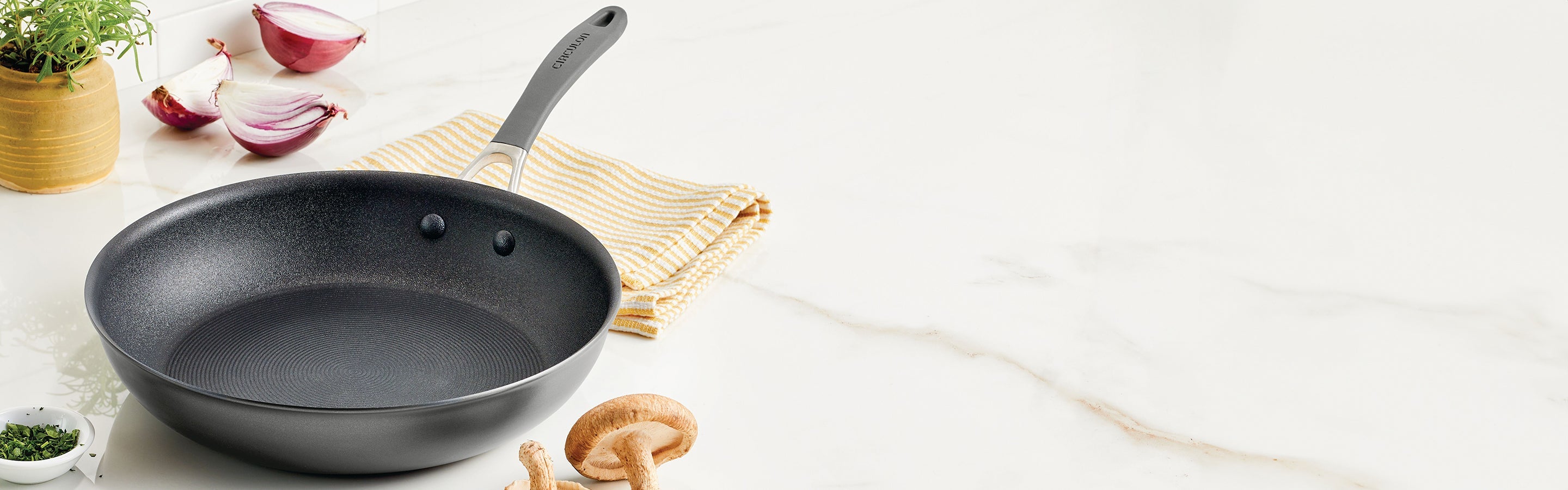 Close-up of a metallic surface with concentric circular ridges creating a textured pattern.