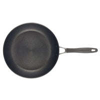 A black non-stick frying pan with a long handle.
