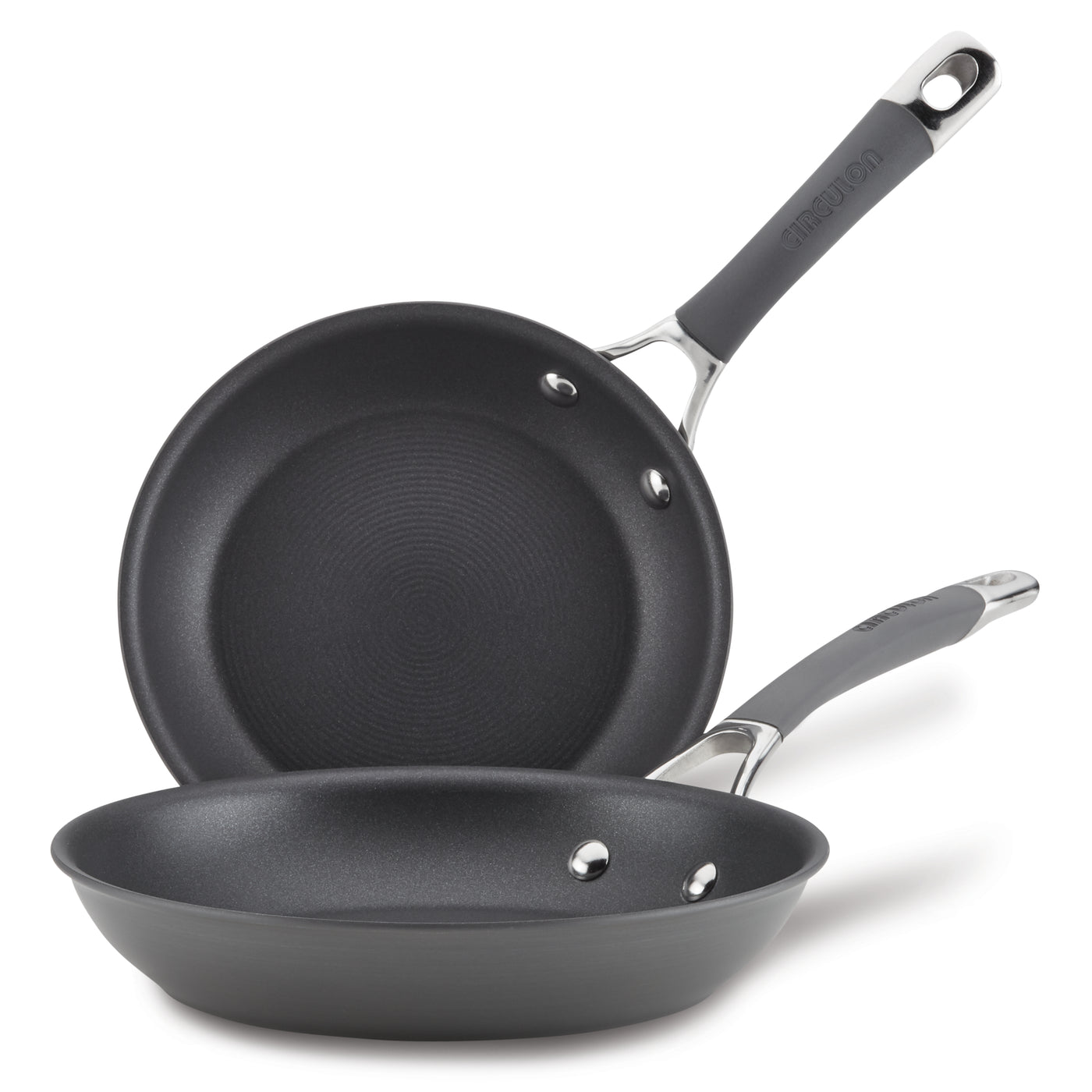 The 2-Piece Nonstick Frying Pan Set includes two black, hard-anodized frying pans with metal handles stacked on top of each other. These dishwasher-safe pans are perfect for any kitchen, offering durability and ease of use without sacrificing quality or style.