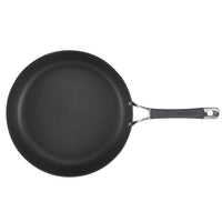 Black non-stick frying pan with a long handle on a white background.