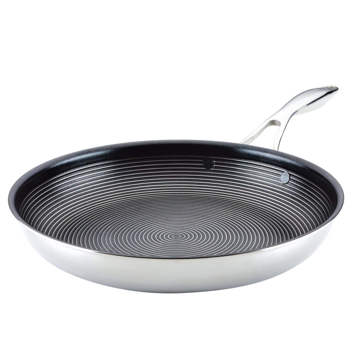 A stainless steel frying pan with a non-stick, circular patterned interior.