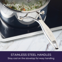 Stainless steel handles on a pot, designed for cool-touch stovetop use.