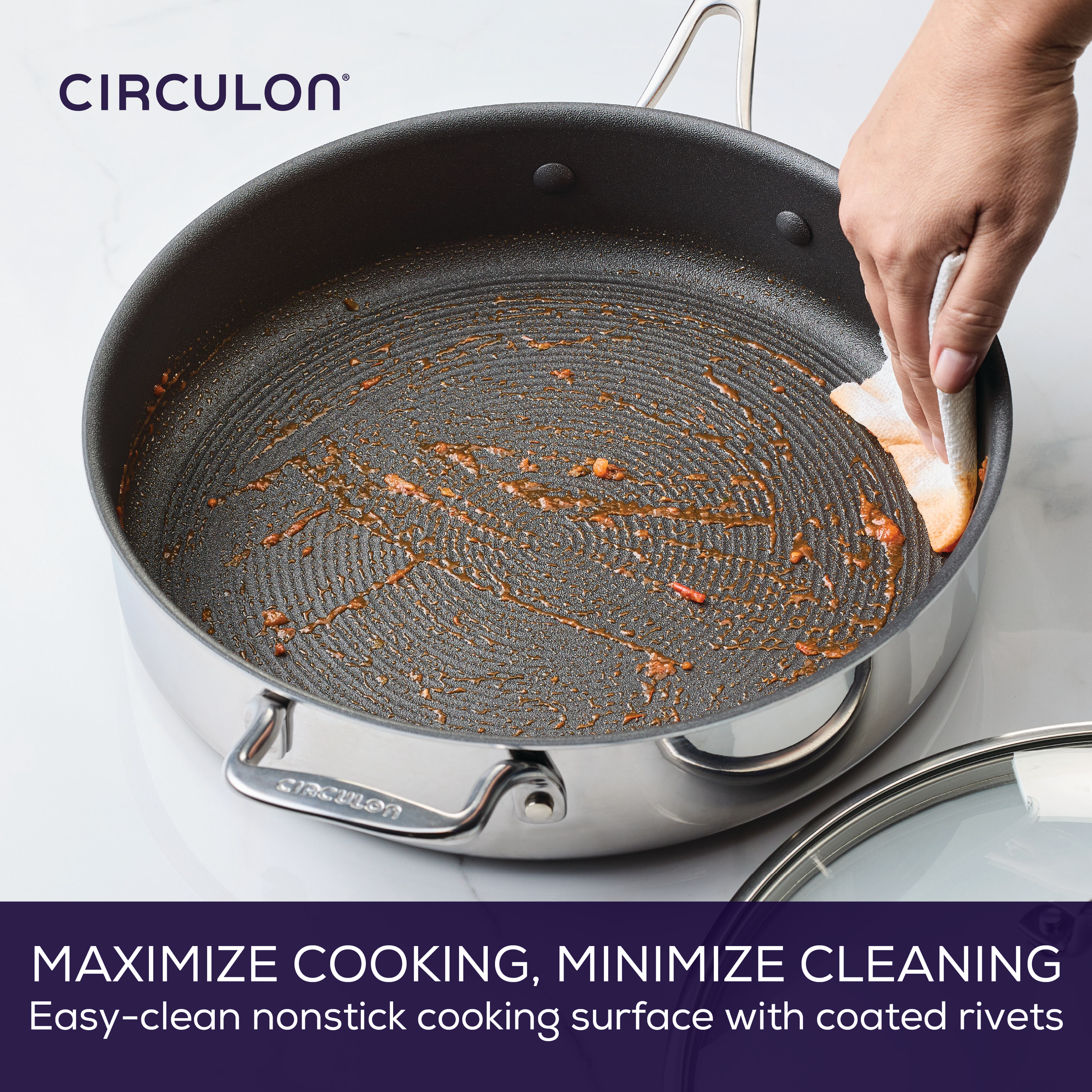 Cleaning a nonstick pan with a cloth, showing minimal residue.