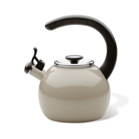 Side view of the gray whistling teakettle with a black arched handle, flip-up spout and stainless steel lid