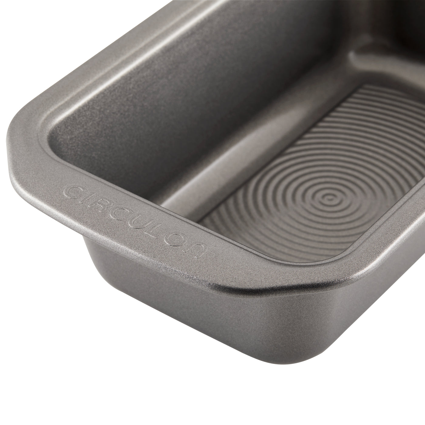 Close-up of an empty, rectangular non-stick baking pan with a textured surface.