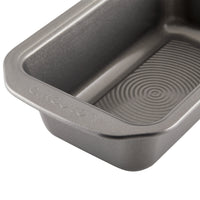 Close-up of an empty, rectangular non-stick baking pan with a textured surface.