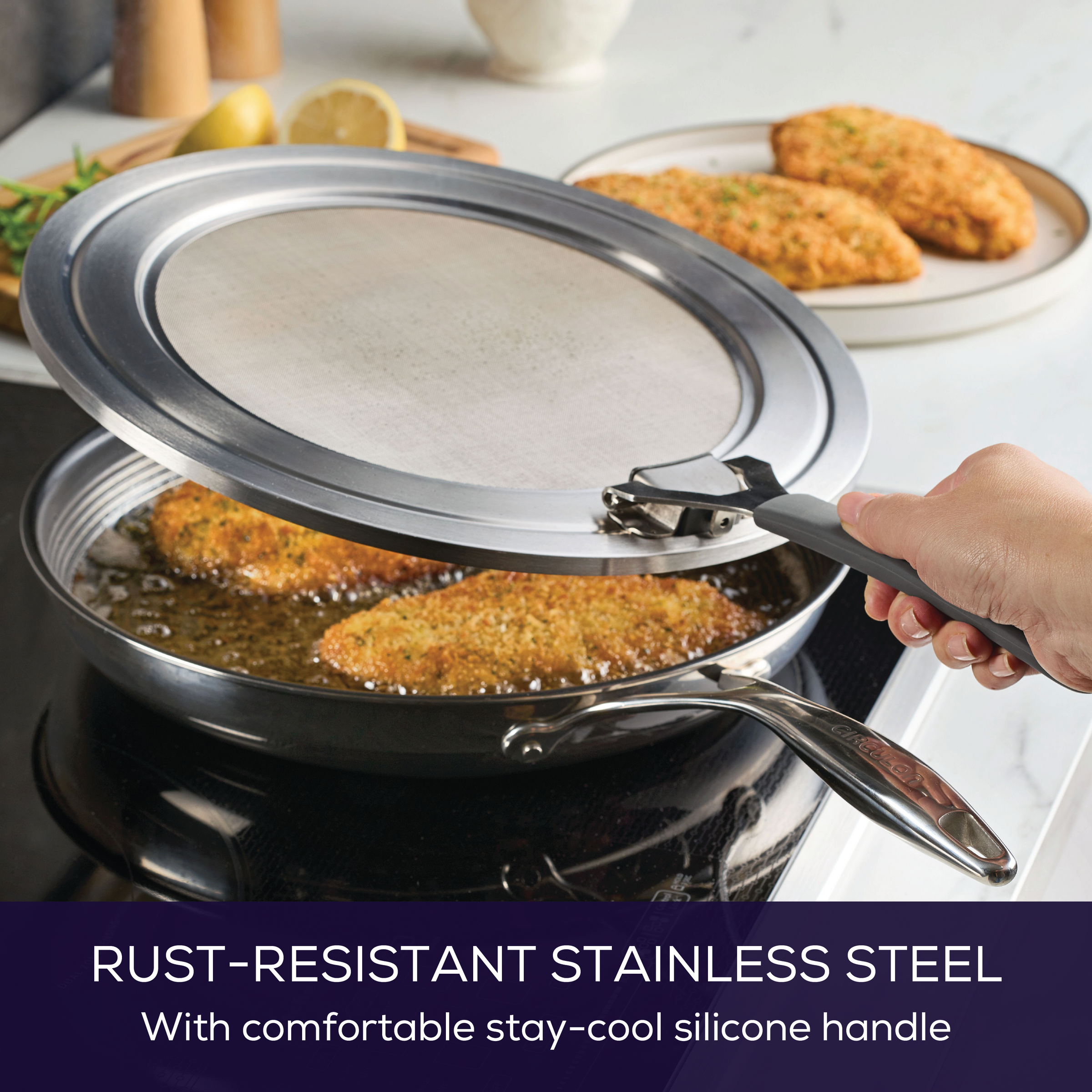 Hand holds Universal Stainless Steel Splatter Guard over sauté pan on stovetop.
