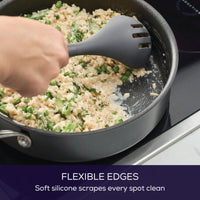 Stir rice and veggies with the 4-Piece Silicone Tools Set in a nonstick pan.