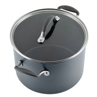 Gray cooking pot with a glass lid and black handles.