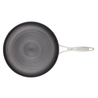 Non-stick frying pan with a spiraled cooking surface and metal handle.