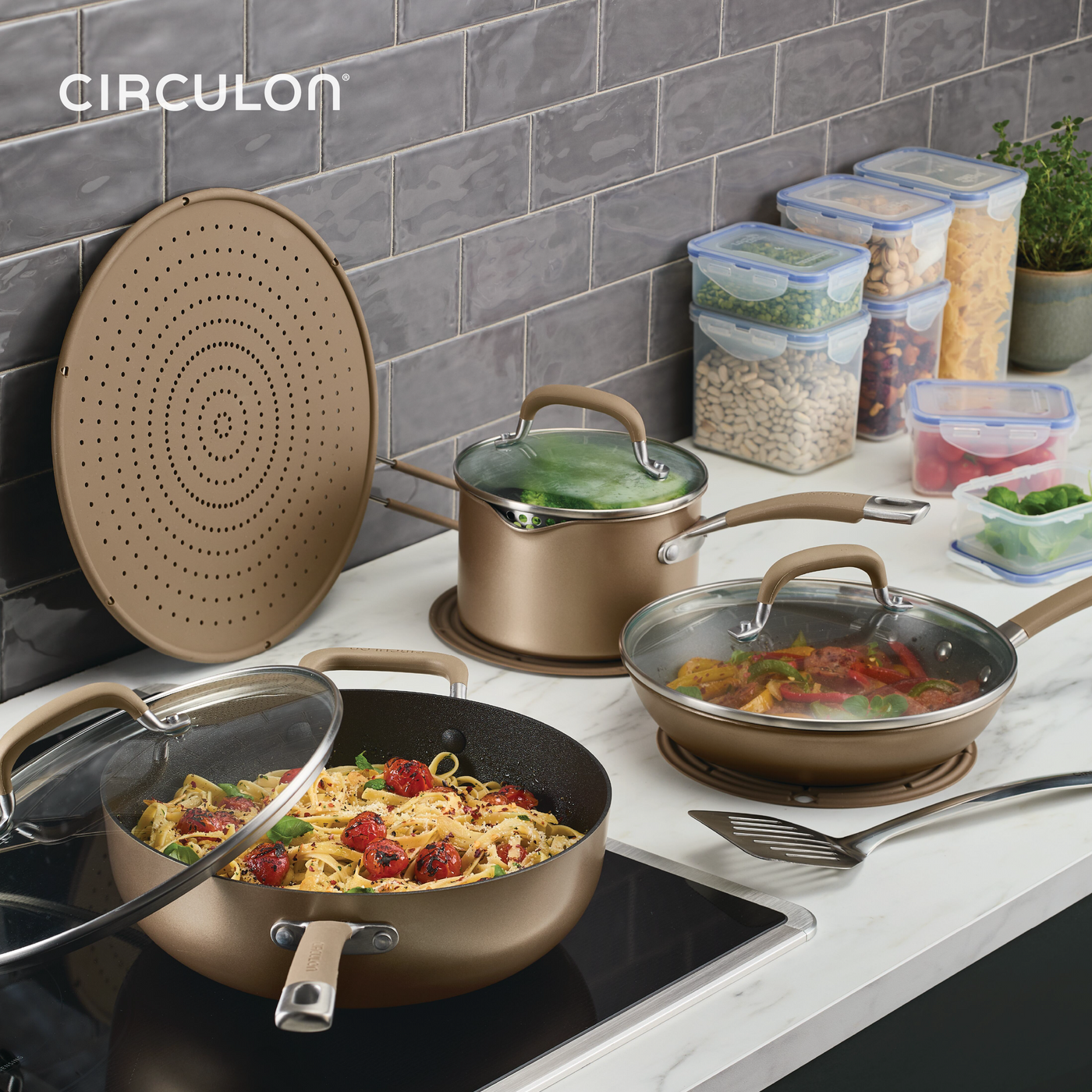 Countertop with ScratchDefense Nonstick Cookware and storage containers.