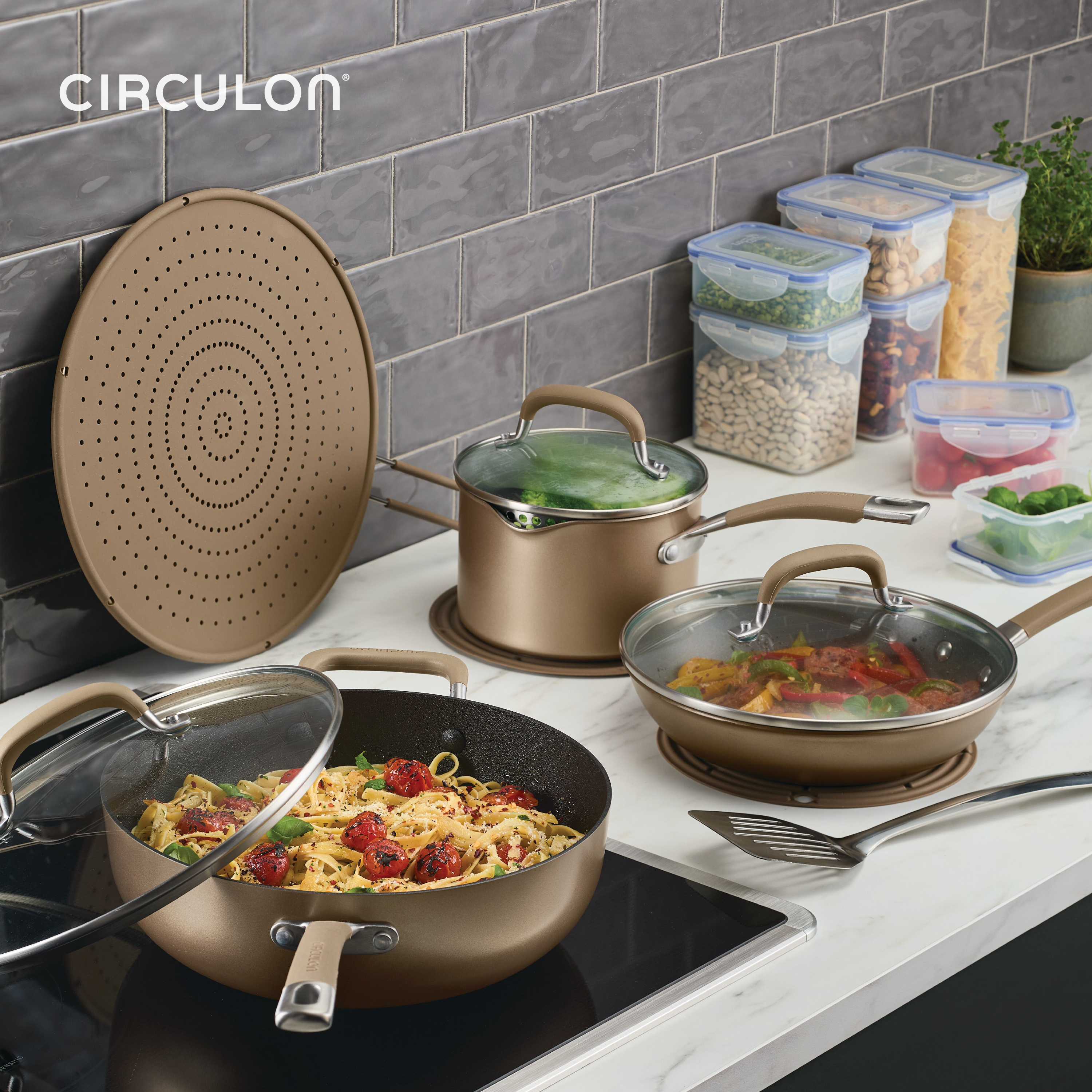 Circulon A1 cookware with pasta, veggies, and a 13-Piece ScratchDefense Set.