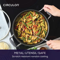 Someone holding a 5-Quart ScratchDefense Nonstick Dutch Oven with Lid.
