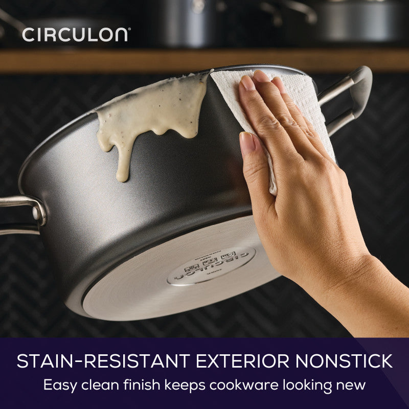 Wiping sauce off 5-Quart ScratchDefense Dutch Oven for easy cleanup.