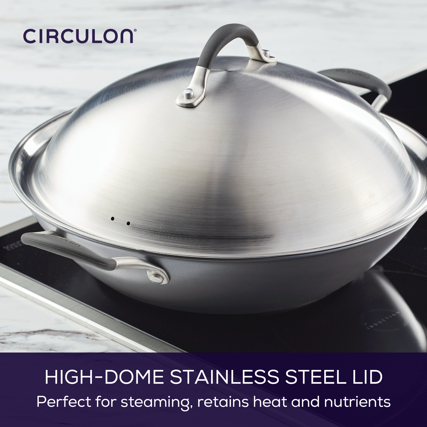 High-dome stainless steel lid on a pan on an induction stovetop.