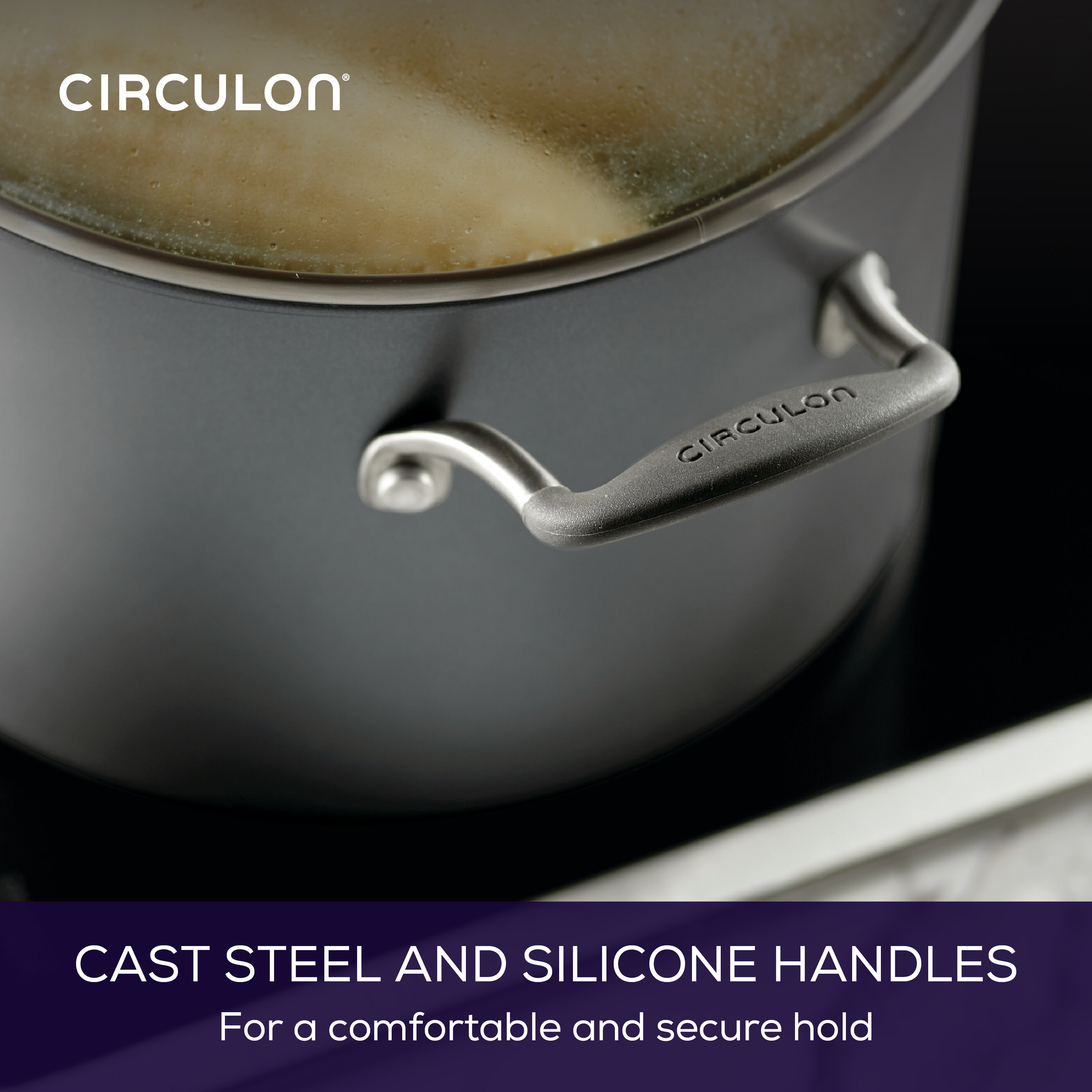 Close-up of a pot with cast steel and silicone handles on a stovetop.