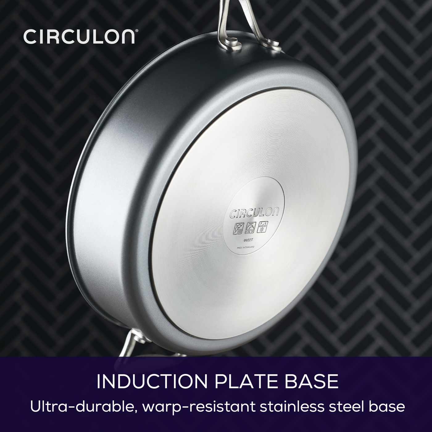 Stainless steel induction plate on a pan base with branding and text details.