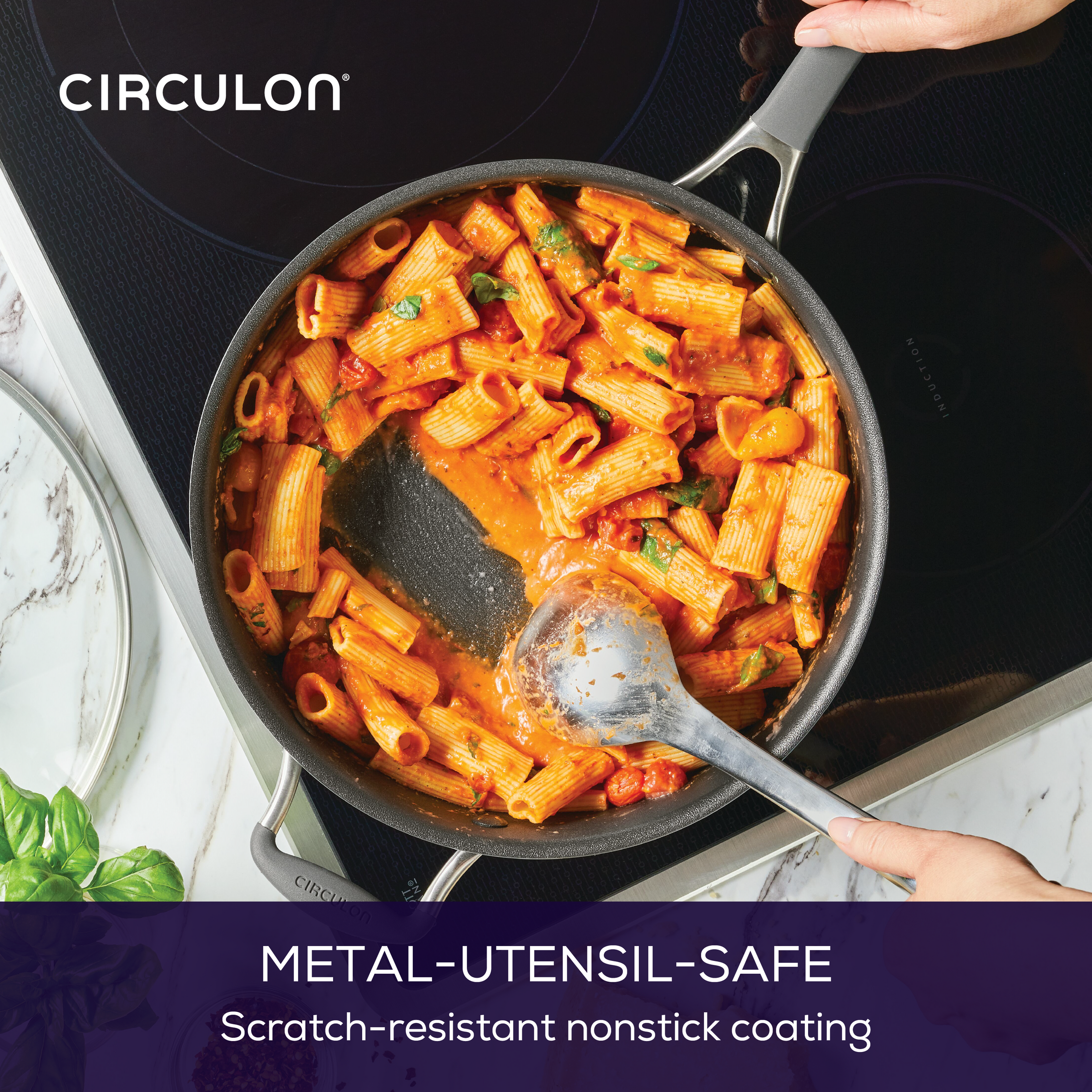 Rigatoni in a ScratchDefense™ pan with red sauce, safe for metal utensils.