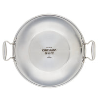Stainless steel pan with two handles and brand name inside.