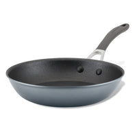 A non-stick frying pan with a gray handle.