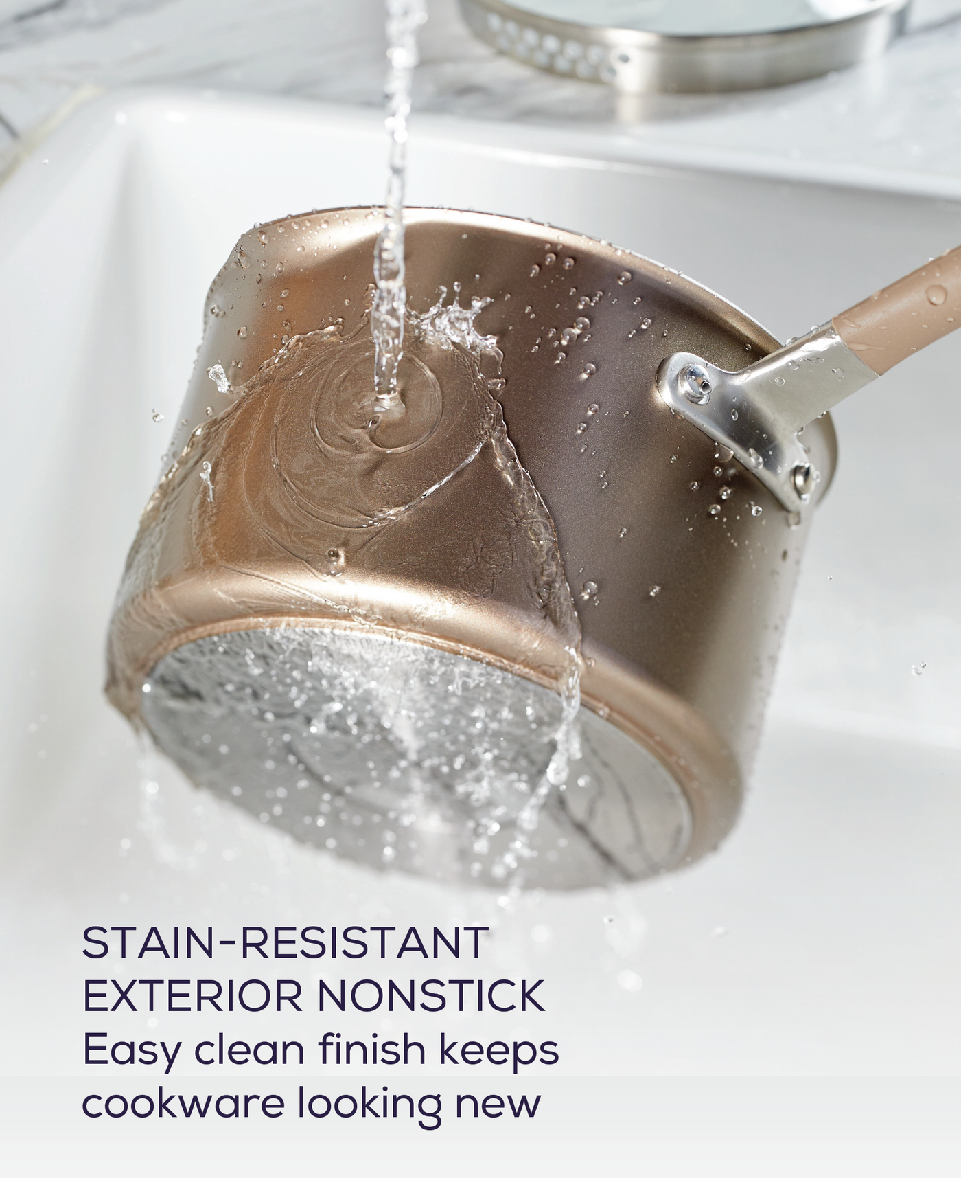 Rinse the 5-Piece Nonstick Cookware Set's pot under running water.