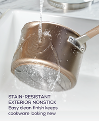 Rinse the 5-Piece Nonstick Cookware Set's pot under running water.