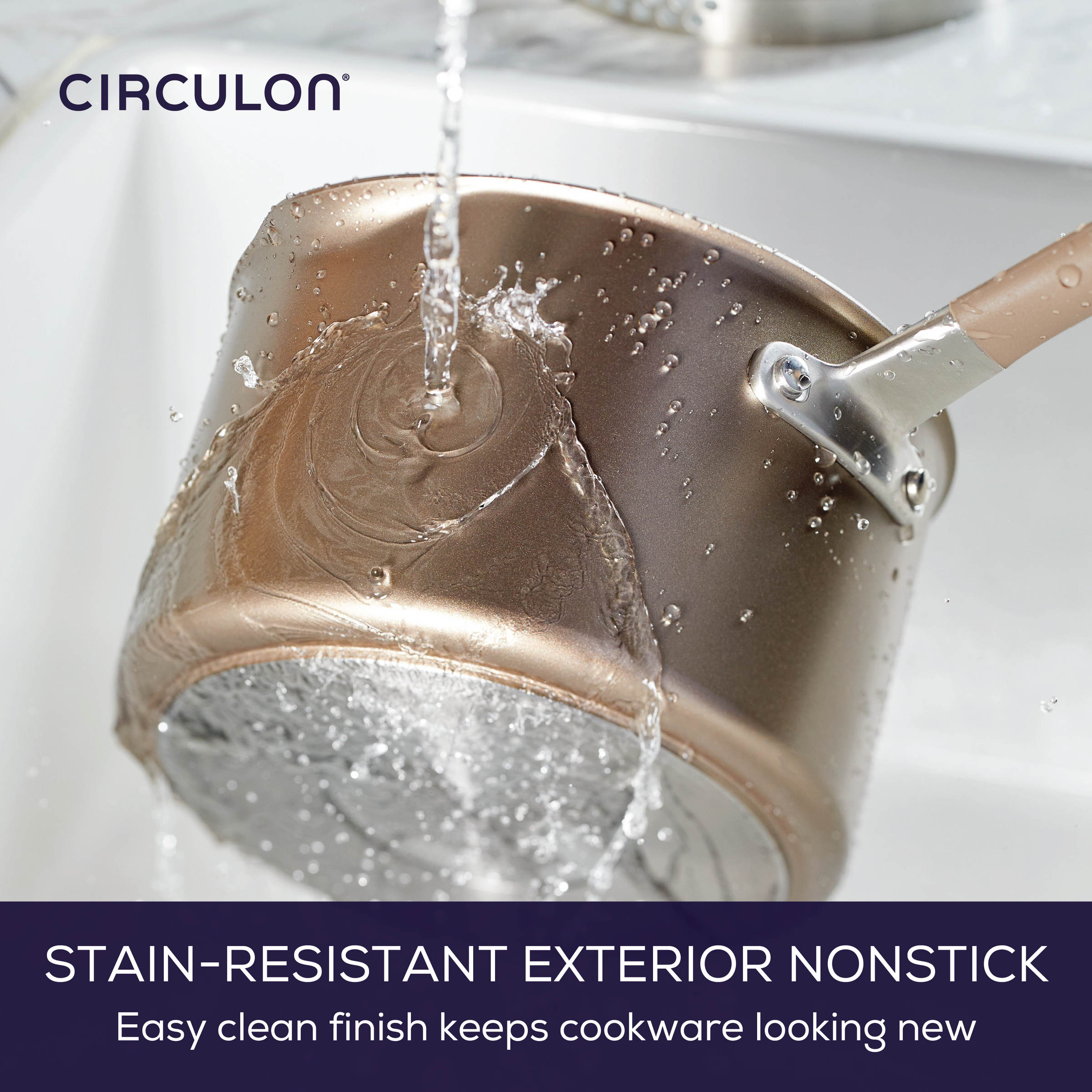 A saucepan being rinsed under a faucet with water flowing over it.