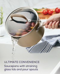 Person pouring water from a 5-Piece Nonstick Cookware Set saucepan into the sink.