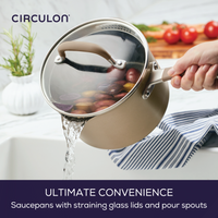 Saucepan with straining lid pouring water into sink.