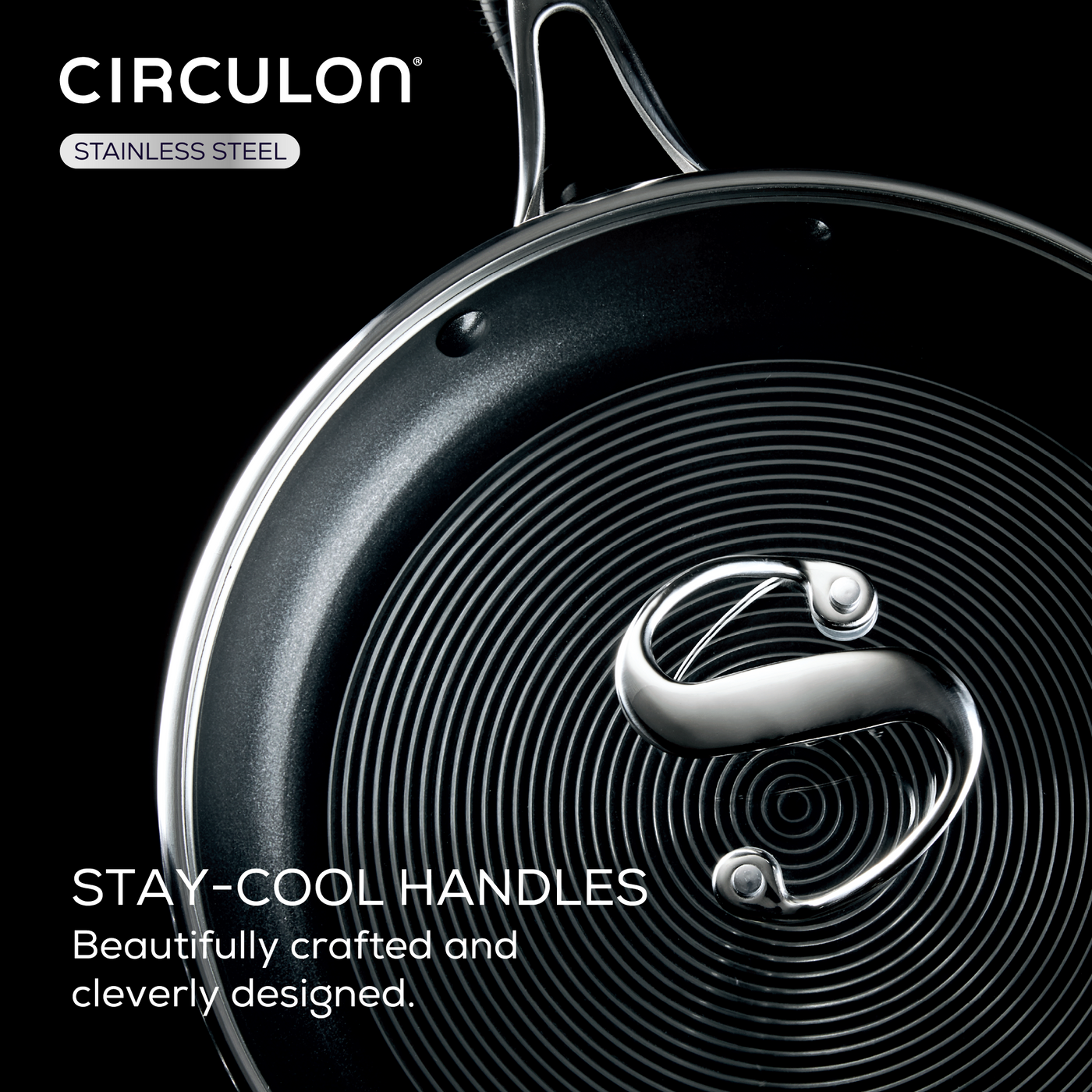 Frying pan with spiral design and a metal handle on a black background.