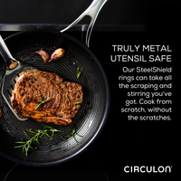 A steak in a pan with a metal spatula and garlic cloves. Text about steel rings.