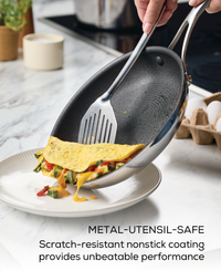 Cooking omelette in nonstick pan; labeled "metal-utensil-safe.