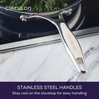 Pan with stainless steel handle on stovetop, sautéed greens inside.