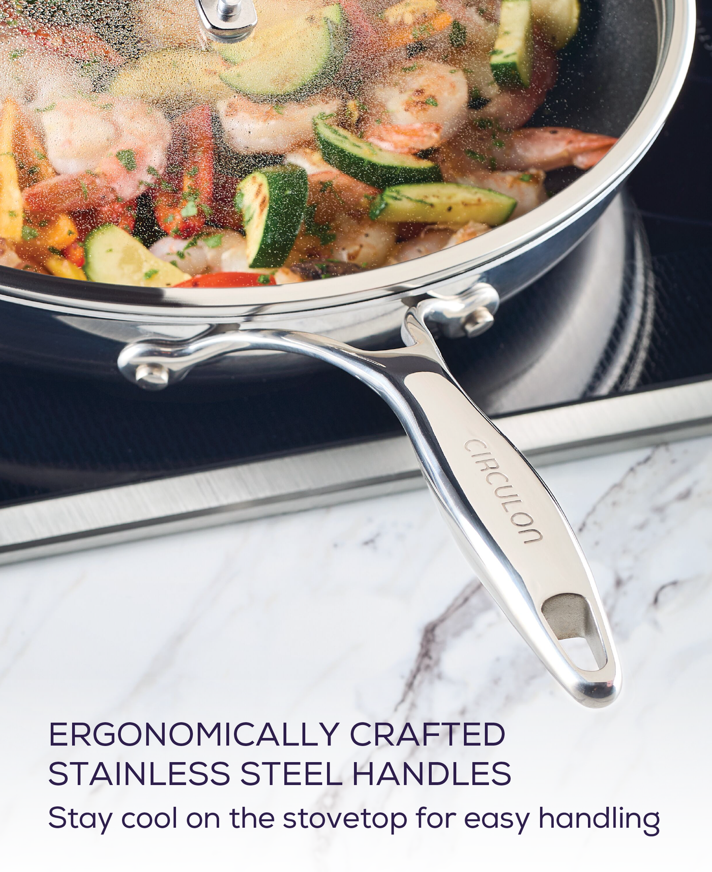 Stainless steel pan with vegetables on a stovetop, featuring a branded handle.