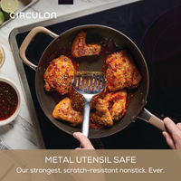 Cooking spicy chicken in ScratchDefense nonstick cookware set on the stovetop.
