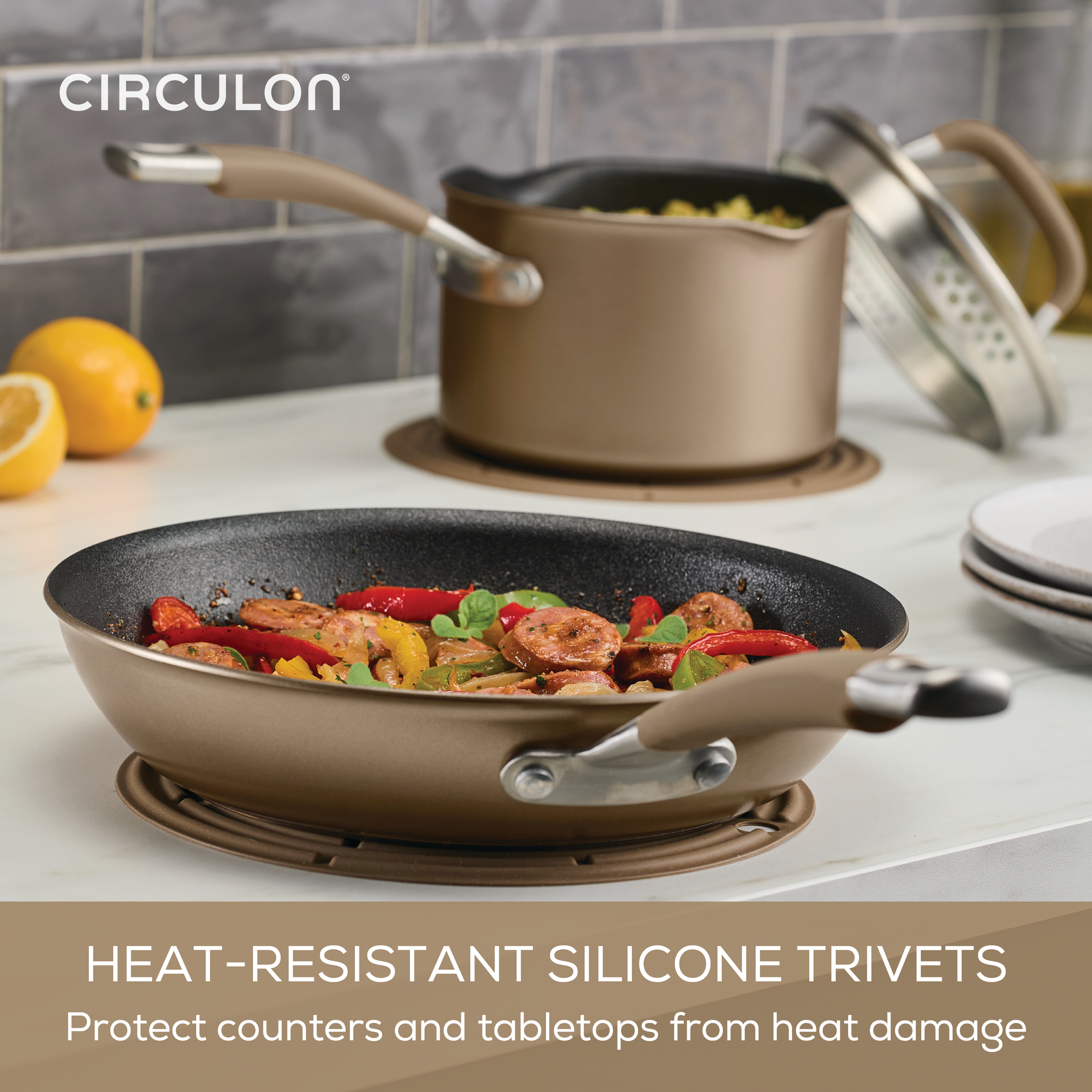 ScratchDefense pan on a trivet by a pot on the countertop.