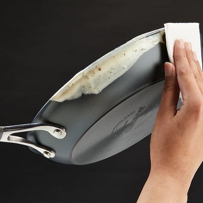 Pan with non-stick coating being easily wiped clean with a cloth.