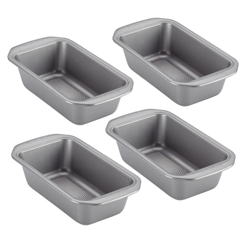 A set of four 9-by-5-inch loaf pans crafted from heavy-gauge steel arranged in a grid, designed with a dependable nonstick system for effortless baking.