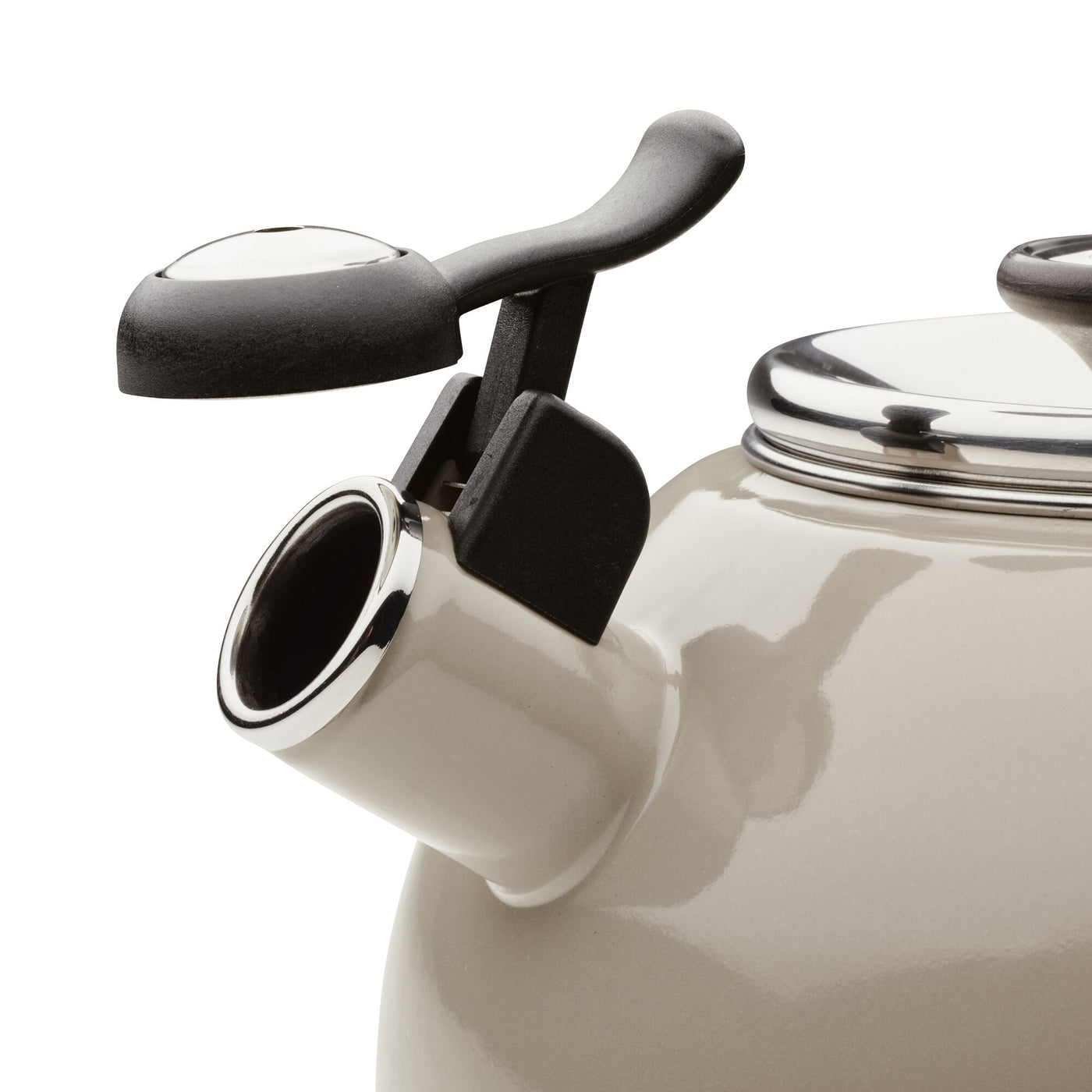 Close-up of a beige kettle spout with a black handle and silver accents.