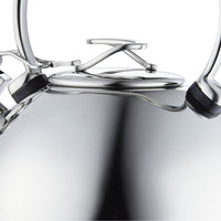 Close-up of a polished metal object with interlocking and curved components.