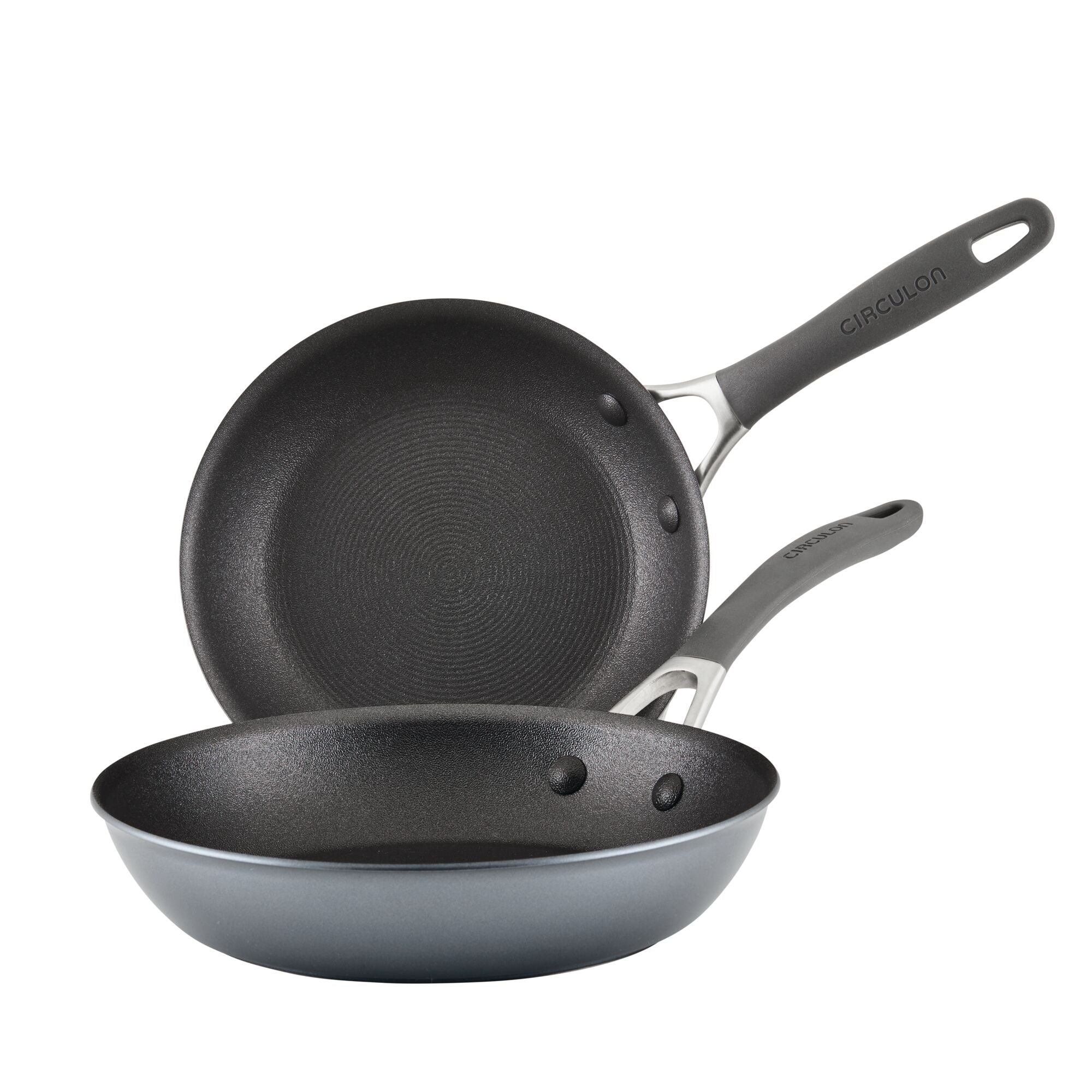 Two non-stick frying pans with gray handles stacked together.