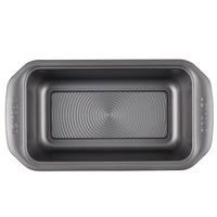 The 9-by-5-Inch Loaf Pans, part of a set of four, feature an empty gray design with a ridged bottom and are crafted from steel to ensure superior heat distribution when viewed from above.