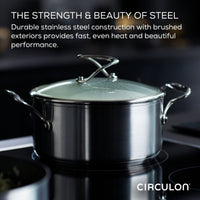 Stainless steel pot with glass lid on a stove, brand name Circulon shown.