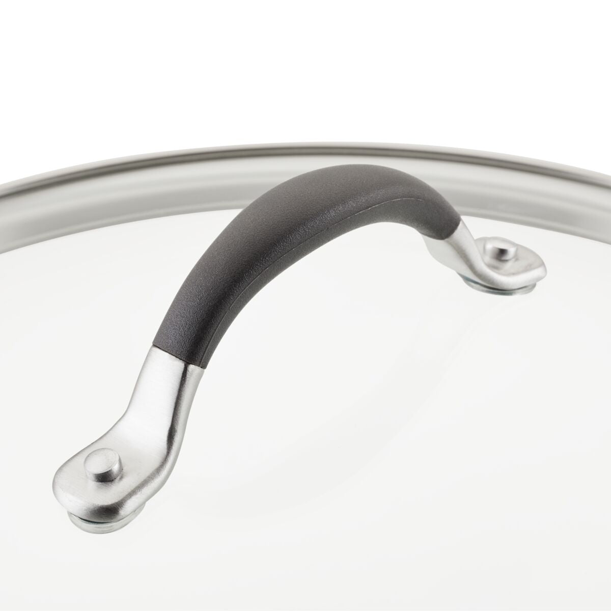 Close-up of a pot lid with a black handle and metal accents.