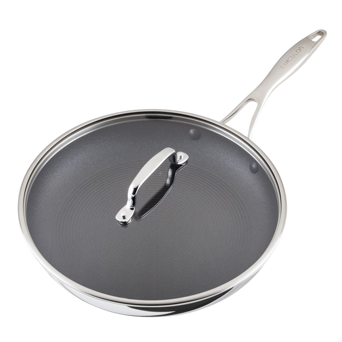 Stainless steel frying pan with a lid and ergonomic handle.