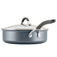 Gray saucepan with a lid and black handle on a white background.