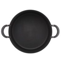 Top view of a large black cooking pot with two handles.