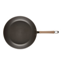 Nonstick frying pan with a long handle, viewed from above.
